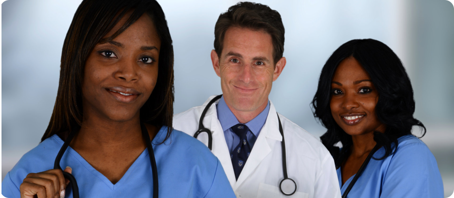 A doctor standing in between two nurses